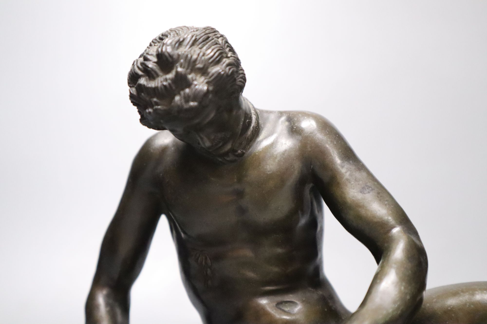 After the Antique. A 19th century bronze figure of the Dying Gaul, length 28cm